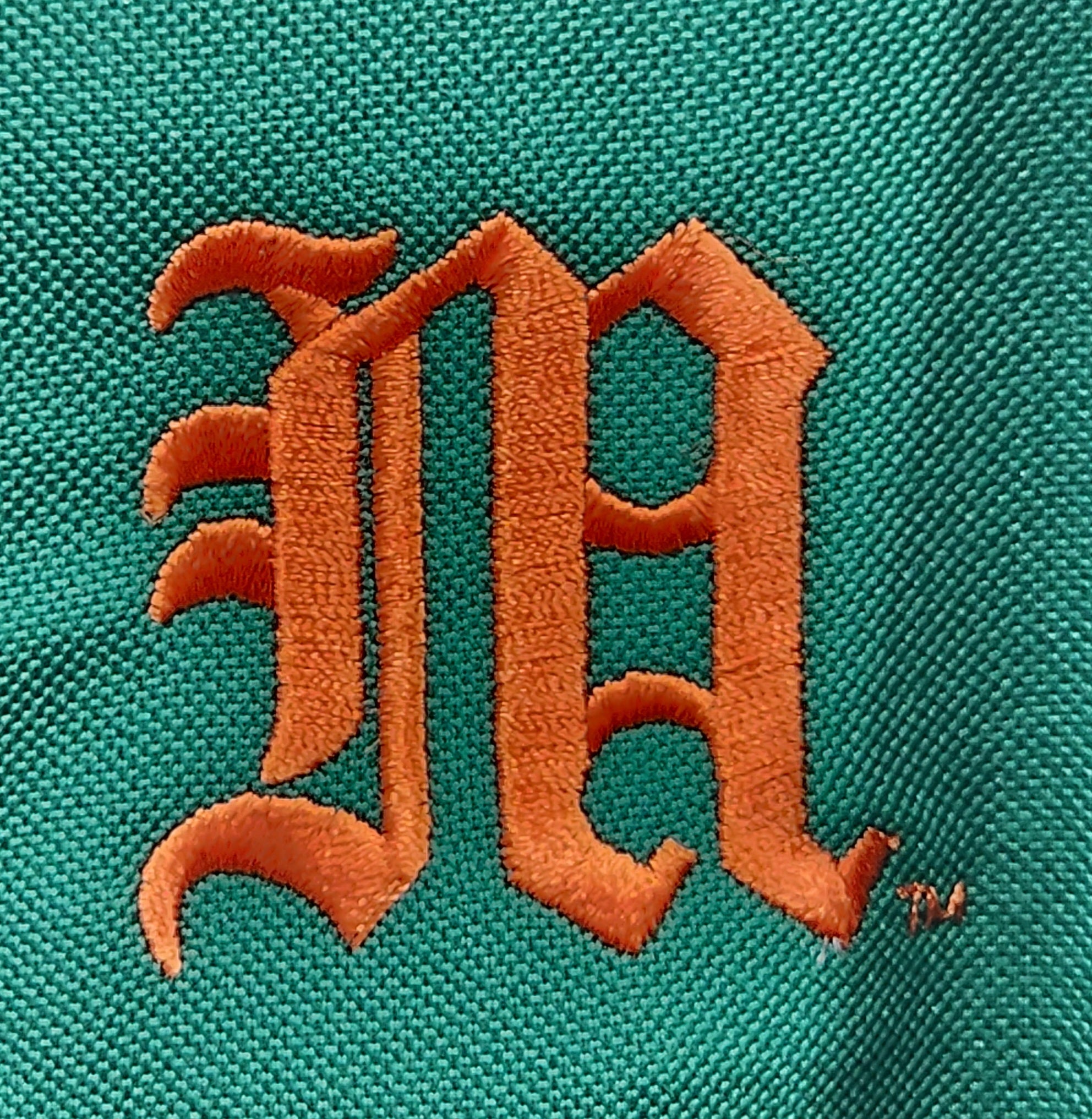 Miami Hurricanes Baseball Antigua Old English M Affluent Polo - Green