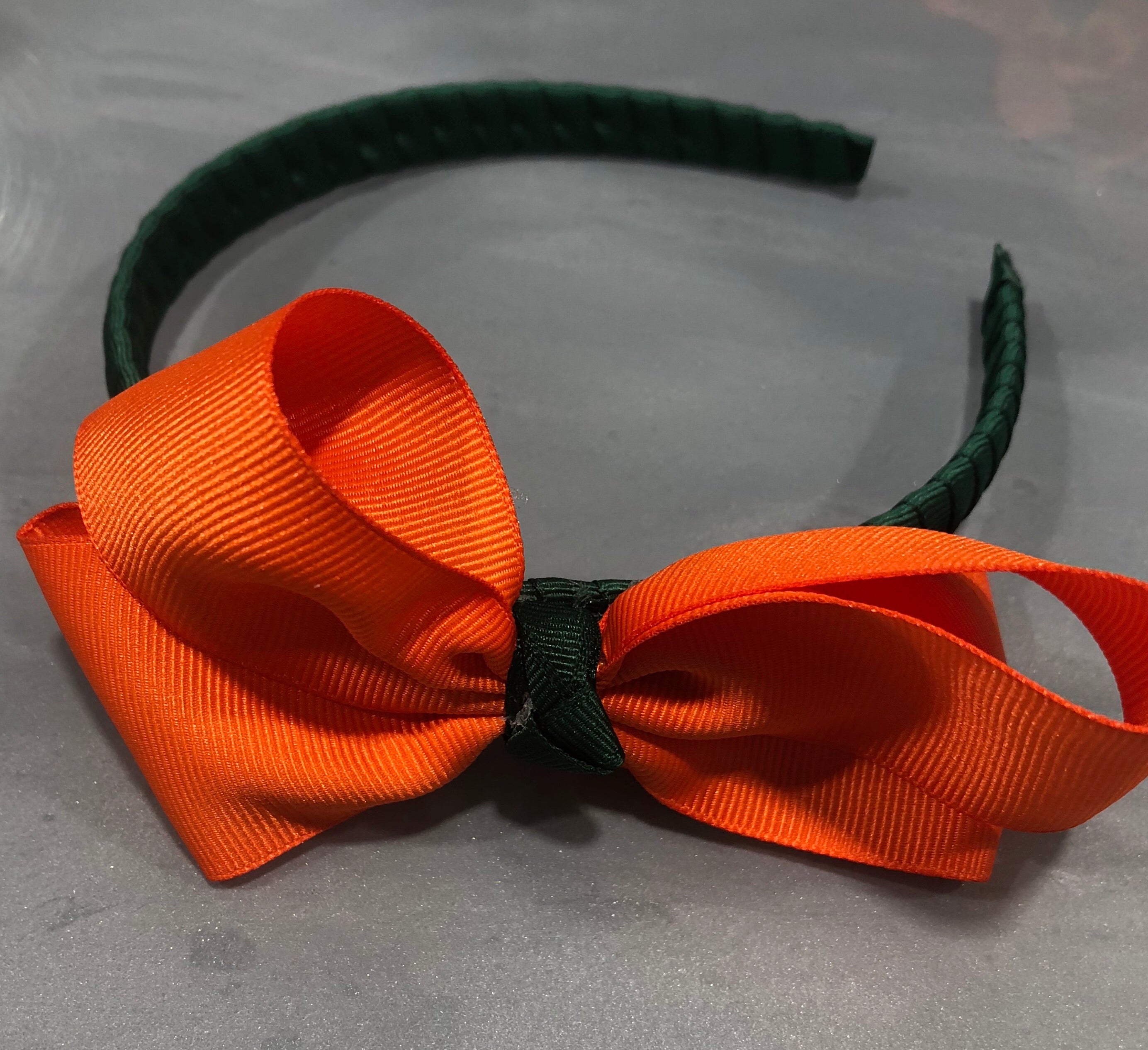 Green Headband w/Orange Bow