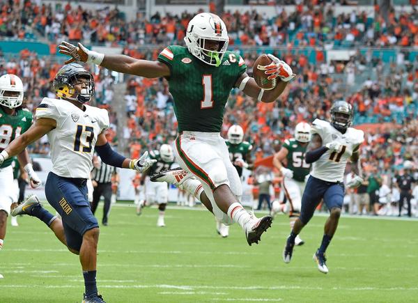 Mark Walton Signed Photo - Leaping Endzone